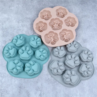 KittyNook Cat Co. Paw Print Silicone Baking Molds—non-stick, pink/blue/gray, perfect for cute pet treats.